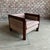 This cubed club chair has curved oak arm rests that waterfall right into the legs breaking up the structured lines and...