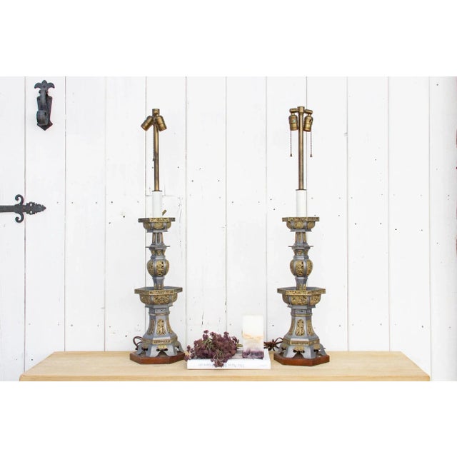 Pair of 1970's pewter candlesticks made into a lamp. These custom vintage pagoda shaped table lamps feature a silver and...