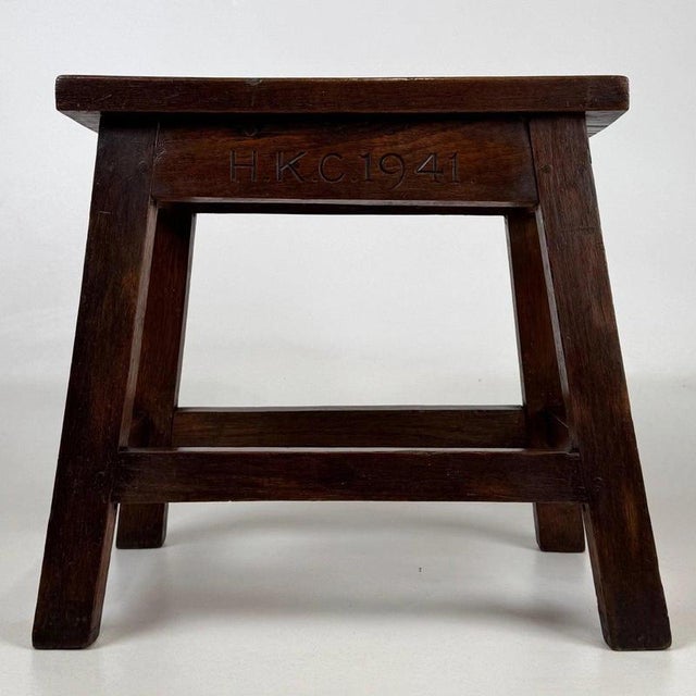 A charming English joined oak stool dating to 1941, finely crafted and distinguished by its hand-carved inscription,...
