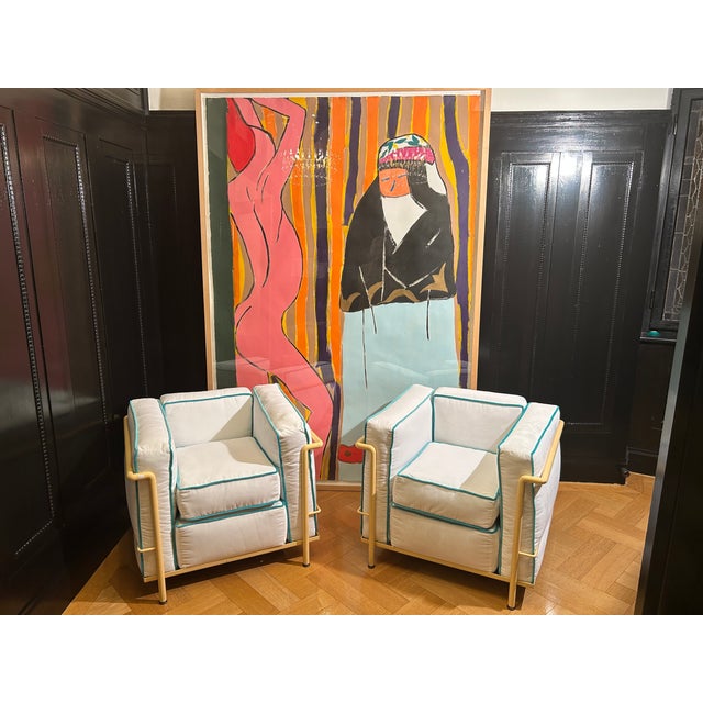 This pair of LC2 armchairs by Le Corbusier for Cassina was designed in a special version: The tubular steel frame is...