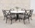 An elegant Albemarle round dining table (model 920A-A-45-RD) by McKinnon and Harris, constructed from aluminum and...