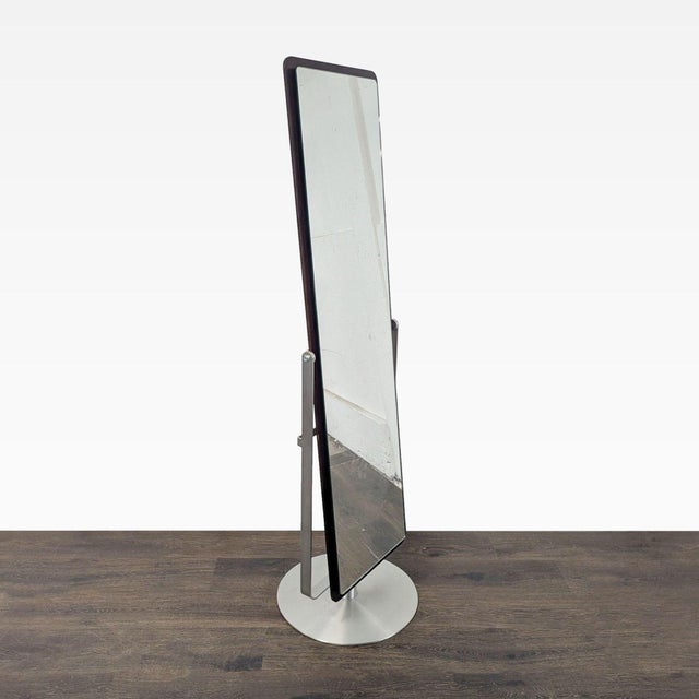Continuum is a modern cheval mirror that includes a swivel base and smooth tilt function, allowing for effortless...