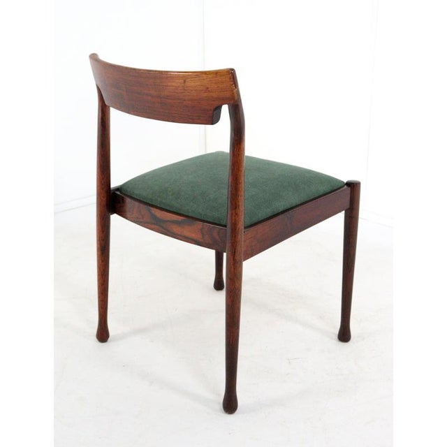 This set of four elegant dining chairs is a beautiful example of Mid-Century Modern design, crafted from high-quality...