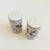A pair of vintage ceramic salt and pepper shakers, made in Japan by Takahashi. Finished in glossy white glazes, each is...