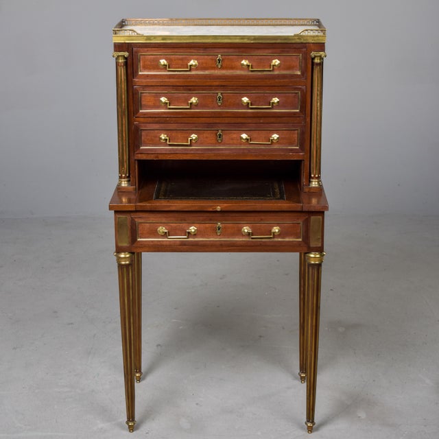 Found in France, this small writing desk, or bonheur du jour, dates from approximately 1900. The desk appears to be made...