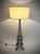 Add a touch of Paris into your home with this Eiffel Tower style floor lamp. Architectural black metal design with a...