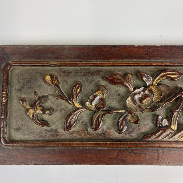 A beautiful small wooden carving that might have been part of architecture or a piece of furniture