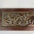 A beautiful small wooden carving that might have been part of architecture or a piece of furniture