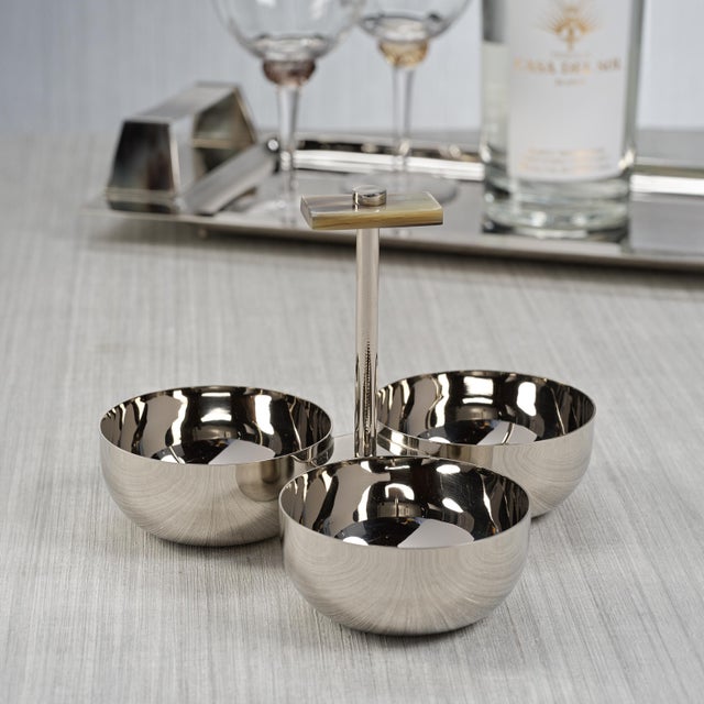 Upgrade your table with our timeless form and polished nickel with horn handle condiment set that features 3 perfectly...