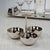 Upgrade your table with our timeless form and polished nickel with horn handle condiment set that features 3 perfectly...
