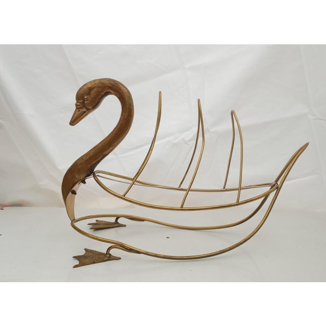 Vintage Swan Magazine Holder - Gilded Bronze, elegant design from the 50s and 60s. This exquisite vintage swan-shaped...
