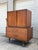 Stunning rare mid century modern gentleman’s chest (unmarked). Featured gorgeous sculpted walnut handles. The top opens to...