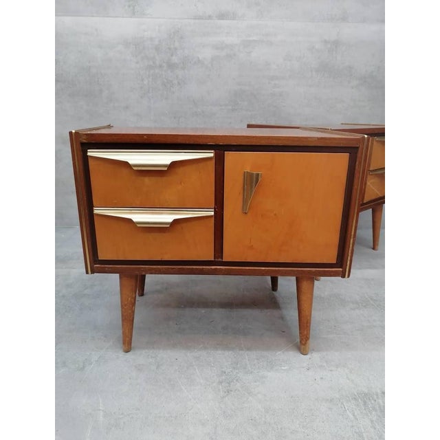 A set of Mid-Century Modern vintage maple wood bedside tables or small chests of drawers designed and manufactured in...