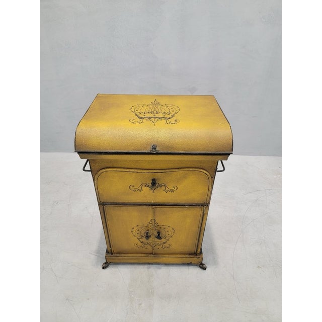 Antique Italian Yellow Metal Wash Stand Now featuring this 19th Century metal wash stand in yellow. The table top opens to...