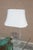 A vintage table lamp, made of lucite and etched with a pagoda design. White linen shade NOT included. Excellent condition;...