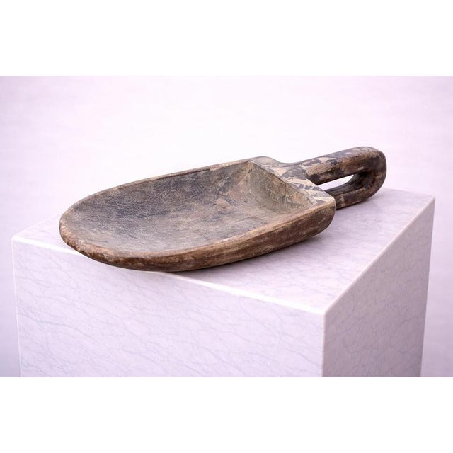 A rare and highly evocative mid-19th century Swedish wooden scoop or grain spade, carved by hand from a single block of...