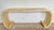 An Asian inspired scrolled console table covered in lacquered goatskin. Attributed to Karl Springer from the 70’s.
