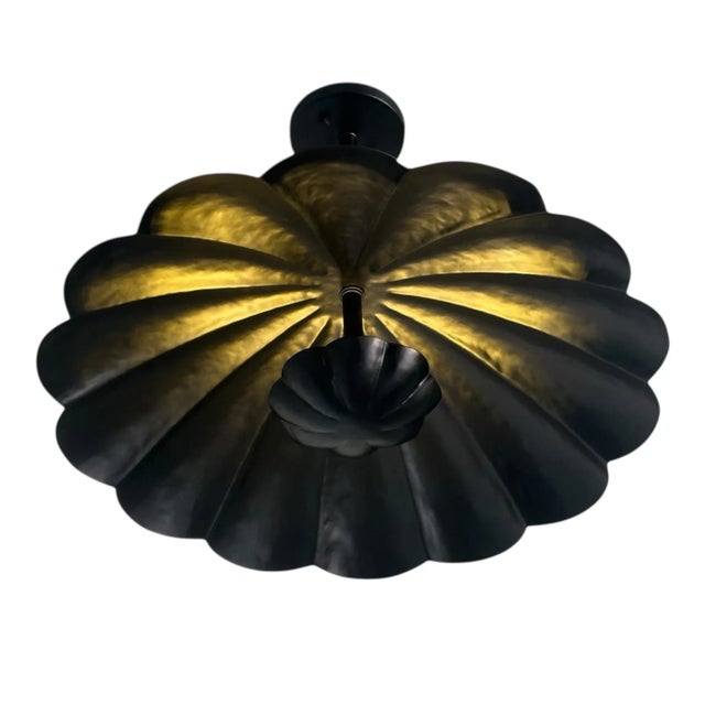 Elevate your space with this stunning modern flush mount ceiling light fixture, featuring a scalloped brass shade finished...