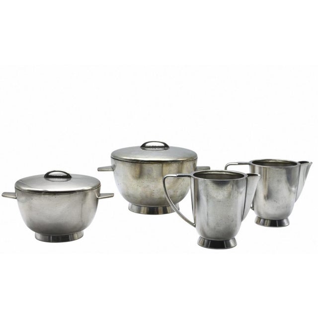 A set of two nickel silver coffee pots and two serving tureens designed by Gio Ponti and produced by Fratelli Calderoni in...