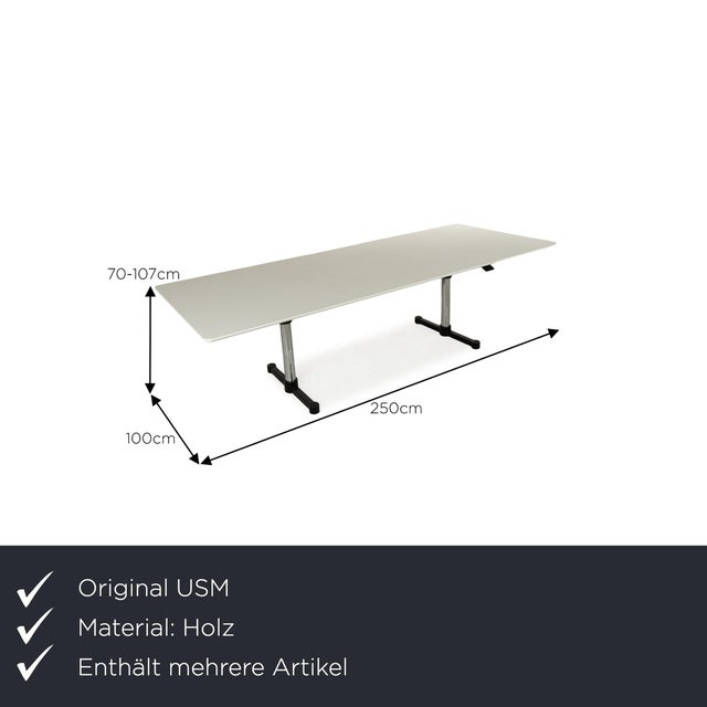 The Haller Kitos dining table from USM consists of a white table top and stands on a metal frame. It is characterized by...