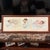 Beautiful vintage 1991 lithograph by Bessie Peace Gutmann. Framed in wooden frame with matting surrounding the 3 babies....