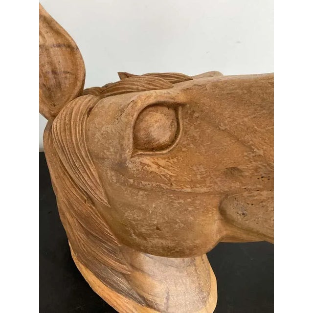 1960s Hand carved horse head. Carved from one piece of solid wood. One ear is missing.