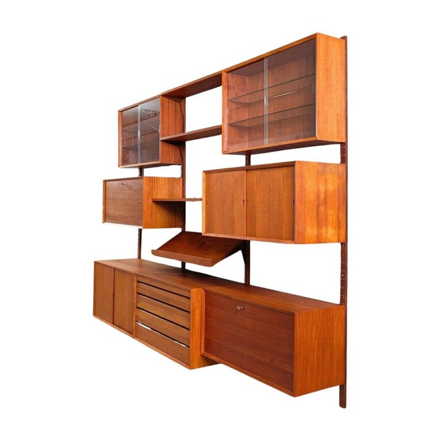Beautiful large wall shelf from the traditional Danish manufacturer Cado from the 1960s. The shelving system was designed...