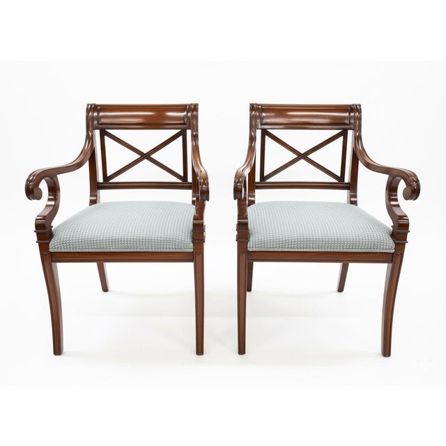 Elegant set of six Baker Furniture Milling Road dining chairs featuring classic X-back styling, newly upholstered seats,...