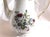 This is a white Winterling teapot in the Bavarian Rose pattern. I do not have date for the pattern. It has a grey rose...