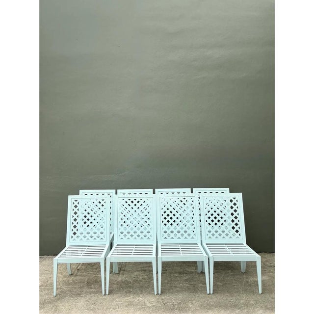 This set of eight vintage dining chairs by McKinnon and Harris showcases a refined lattice design, with backrests formed...