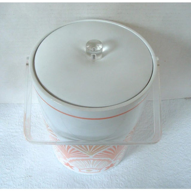 Circa 1970s-1980s, vintage extra tall ice bucket in white vinyl with printed pink, coral and tan scallop sea shell motif....