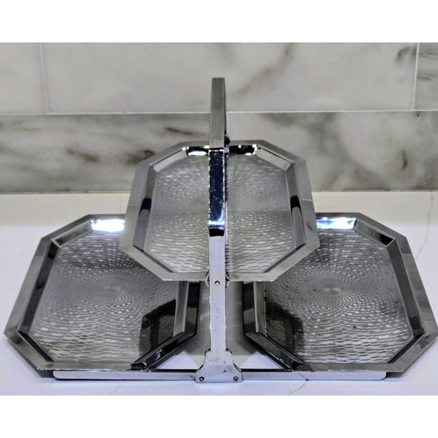 An original 1930s Art Deco chrome-plated serving stand by Chase Brass & Copper Company, featuring three octagonal trays...