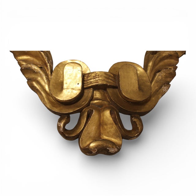 This 18th-century Italian giltwood fragment showcases the elegance of period carving, with softened details and remnants...