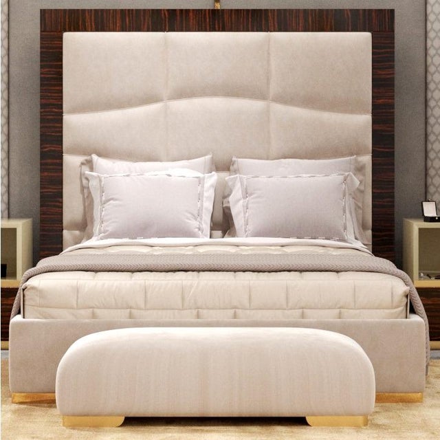 Handcrafted in Italy, this elegant bench features a solid wood frame upholstered in high-quality fabric for a refined and...