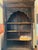 Striking antique wooden bookshelf featuring exquisite hand-carved detailing throughout. This piece showcases traditional...