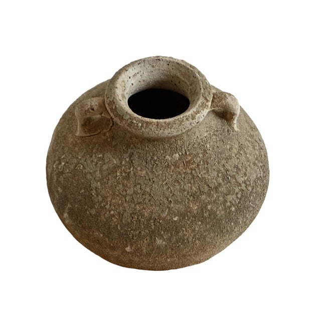 Antique small ceramic pot found along the coastlines of Indonesia. Beautiful displayed in groupings or singularly. Each is...