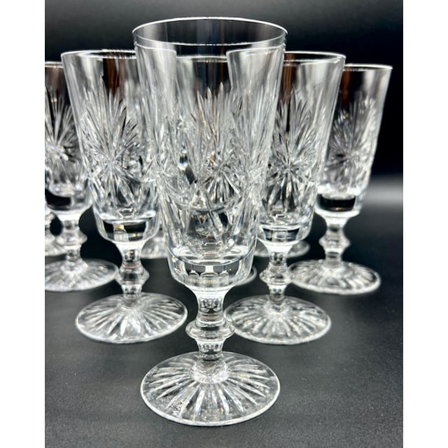 Exceptional fine-quality Edinburgh Crystal champagne flutes, crafted in Scotland and produced in the now-retired and...