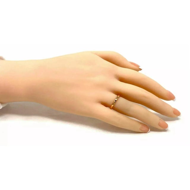 This is a lovely authentic band ring by Tiffany & Co. from the NOVO collection. It is crafted from 18k yellow gold with a...