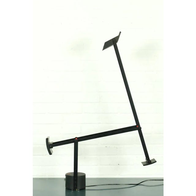 Tizio table lamp designed by Richard Sapper for Artemide, 1972. Halogen table lamp or desk lamp with articulated arms and...