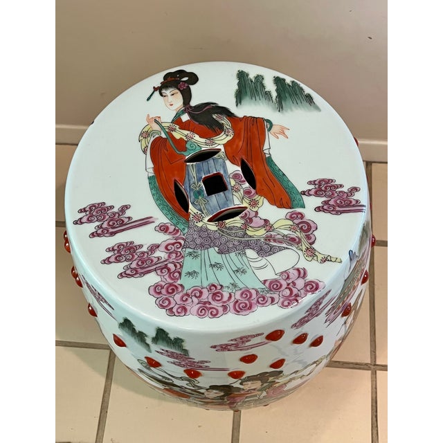 This hand painted garden stool depicts in great detail, figures in a garden or court setting, a common motif for export...