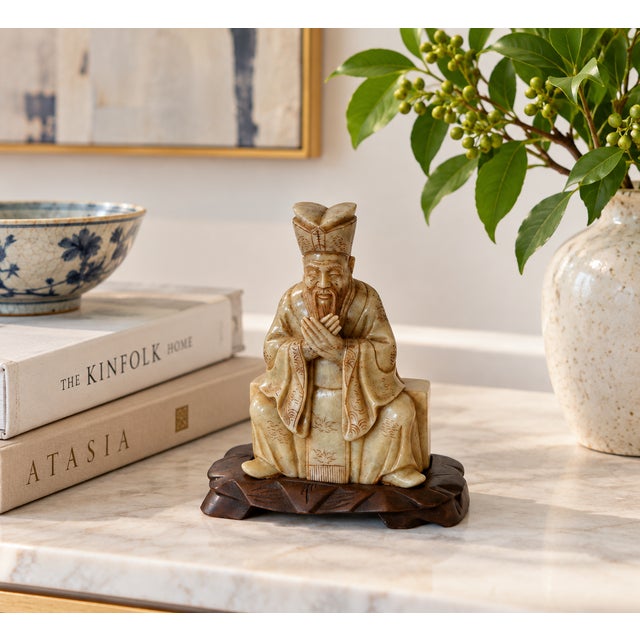 For the collector of Chinese scholar's objects and traditional Asian carvings, this early 20th-century seated figure,...