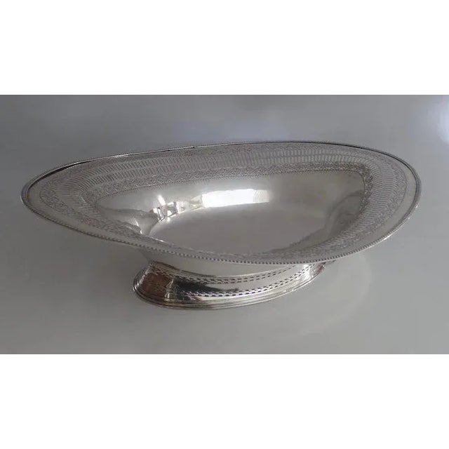 Now a beautiful bowl. Once had a handle. Old Sheffield reticulated footed bowl. Measures 15" by 10 1/2" by 3 1/2".