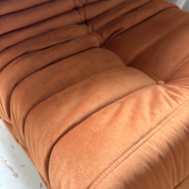Togo armchair reupholstered in brown velvet fabric. The original cover will be included. This piece has an attribution...