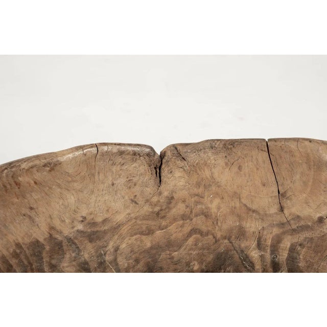 Large primitive oval-shaped dug out bowl from Sweden dating to the mid-19th century. Traces of reddish oxblood color paint...