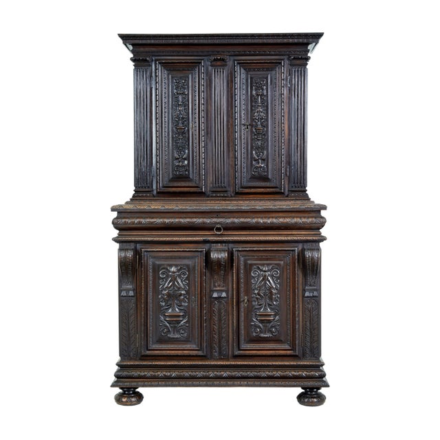 Mid-19th century profusely carved french walnut cabinet, circa 1850. 2 part carved walnut cabinet. Top section of...