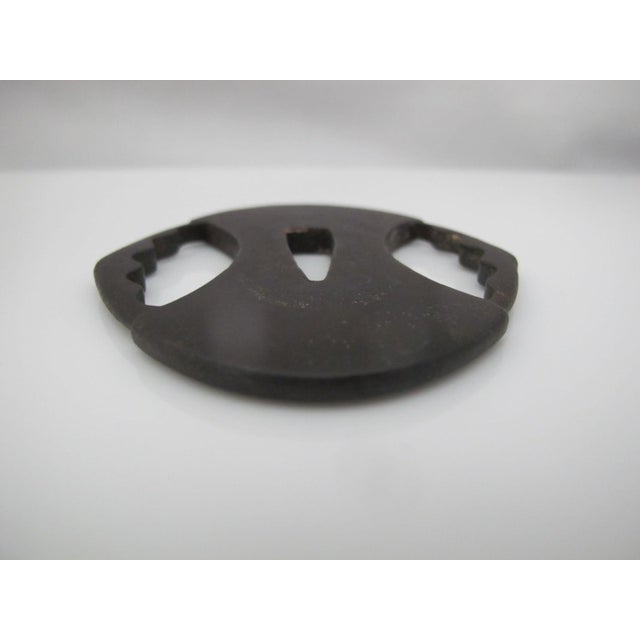 Japanese forged iron Tsuba, or sword guard, most likely Edo era. Tsuba were functional items used to protect the user's...
