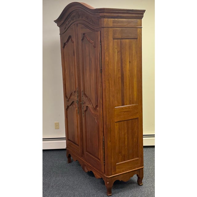 Bring timeless elegance to your home with this stunning solid wood armoire, featuring a beautifully shaped crown,...