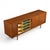 Designed by Ib Kofod-Larsen for Brande Møbelfabrik, this exceptional teak sideboard showcases the refined structural...