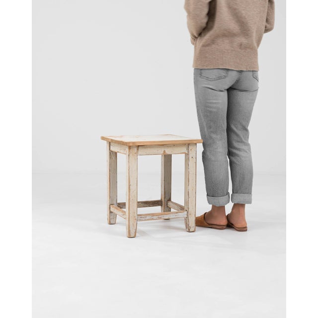 This authentic Early 20th Century Central European stool is a testament to the timeless beauty of utilitarian design....