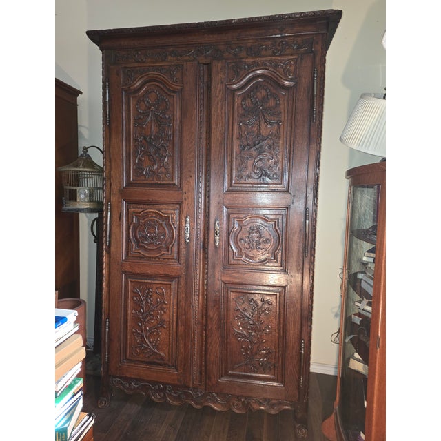 Beautiful circa 1800 heavily carved French Armoire with modified interior file drawers and fully lined vintage Fortuny...
